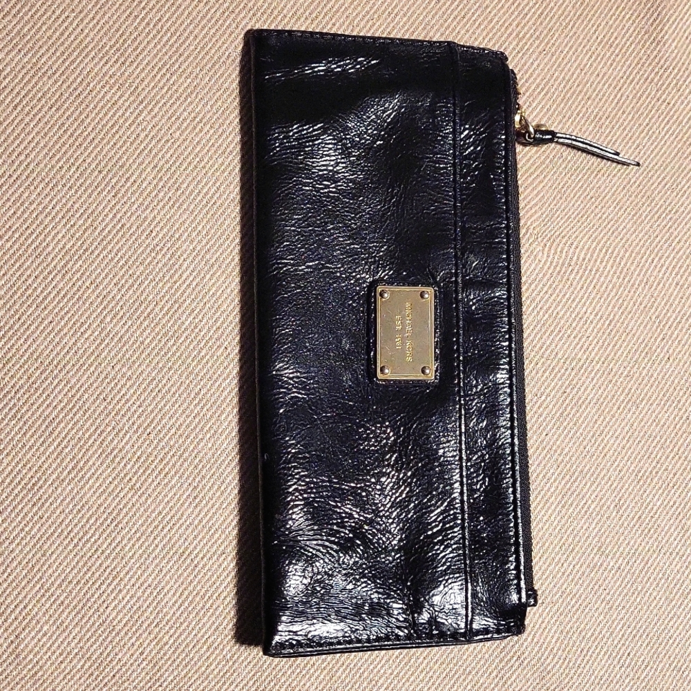 Shiny Black Michael Kors wallet one pocket letter size.